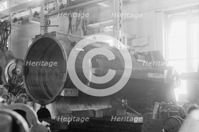 Navy Yard, U.S., Washington - 14 Inch Gun; Various Operations in Shrinking Jacket On It, 1917. Creator: Harris & Ewing.