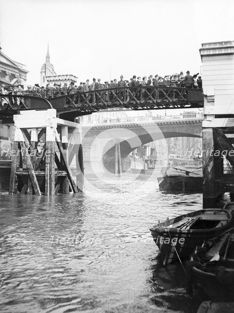 Passengers for the river bus service on the footbridge to London Bridge Pier, London, c1905. Artist: Unknown