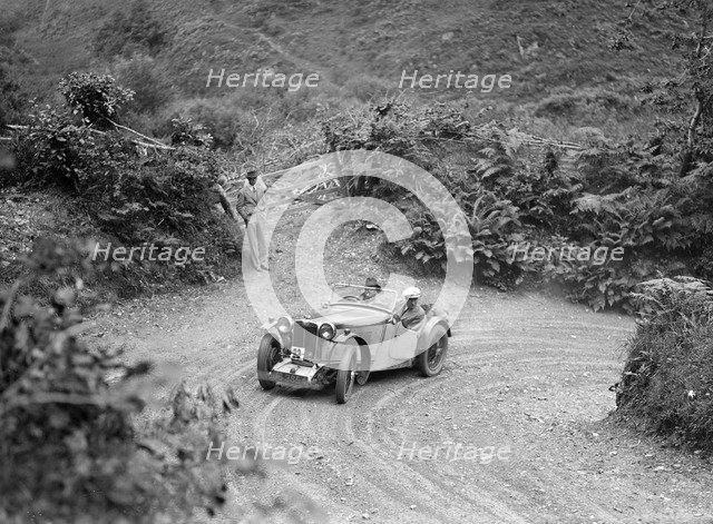 1934 MG PA of the Cream Cracker team taking part in a motoring trial in Devon, late 1930s. Artist: Bill Brunell.