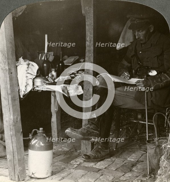 Staff officer in a dugout studying details before an offensive, World War I, 1914-1918Artist: Realistic Travels Publishers