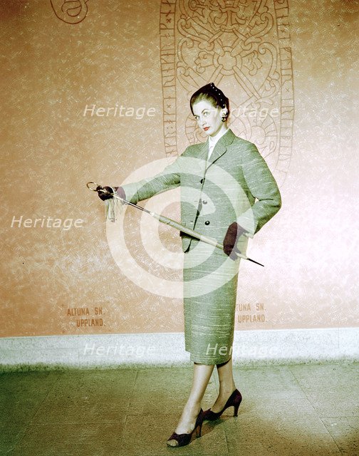 Female model shows a suit, the Historical Museum, Stockholm, 1950s. Artist: Göran Algård