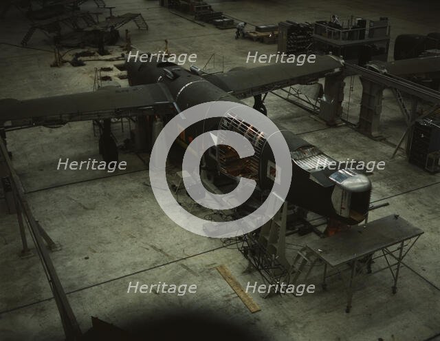A mating operation on a transport plane...Consolidated Aircraft Corp..., Fort Worth, Texas, 1942. Creator: Howard Hollem.