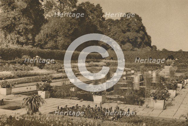 'The Quiet of the Dutch Garden at Kensington Palace Guarded By Locked Gates', c1935. Creator: Unknown.