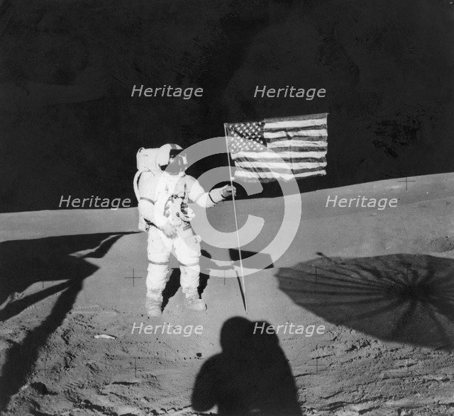 Alan Shepard (1923-1998) planting an American flag during the Apollo 14 mission, 1971. Artist: Unknown