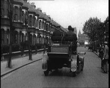 Fire Engine Driving Down the Street, 1920. Creator: British Pathe Ltd.