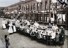 ' A children's tea party in an East End Street in London, to celebrate the Treaty of Versailles at t Artist: Unknown.