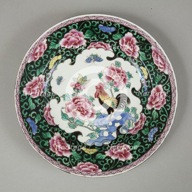 European copy of famille noire plate with cockerel looking at a butterfly, 20th century. Artist: Unknown.