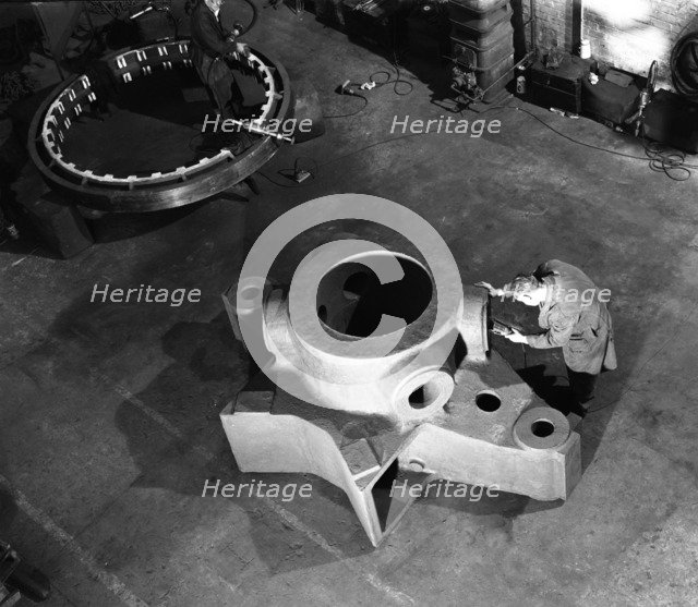 Inspecting a large precision steel casting, Sheffield, South Yorkshire, 1961. Artist: Michael Walters
