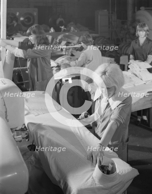 Shirt pressing at a commercial laundry in Scunthorpe, Lincolnshire, 1965.  Artist: Michael Walters