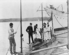 U.S. Naval Academy, Annapolis, Md. 1902?: going aboard the training submarine, (1902?). Creator: Frances Benjamin Johnston.