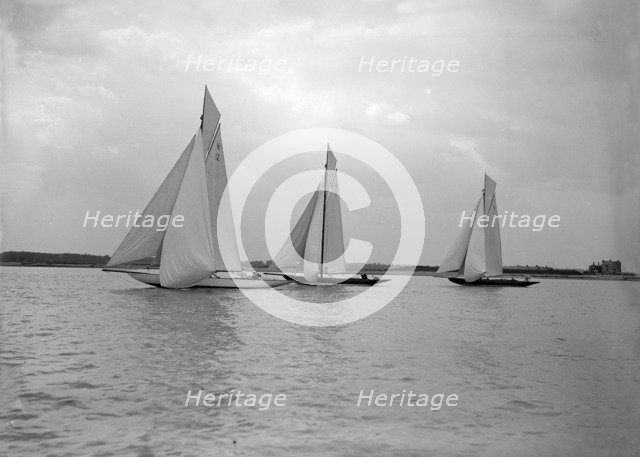 No wind for the 8 Metre class 'The Truant', 'Spero' and 'The Antwerpia IV', 25th May 1912. Creator: Kirk & Sons of Cowes.