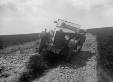 Kitty Brunell road testing a Riley 9 WD tourer, c1930. Artist: Bill Brunell.