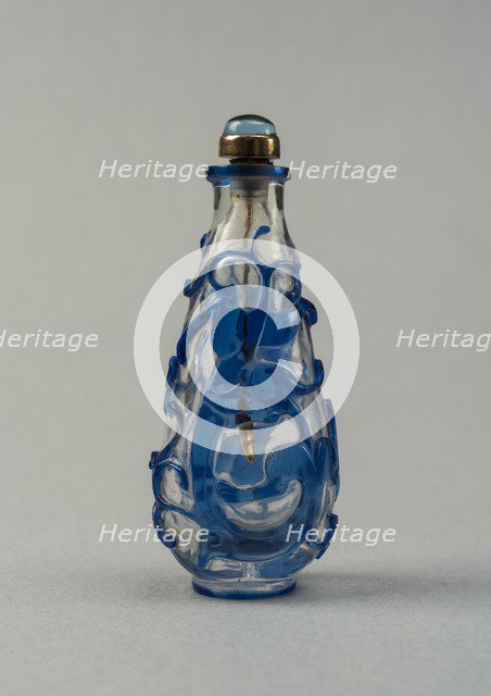 Clear glass snuff bottle with blue overlay, China, Qing dynasty, 1644-1911. Creator: Unknown.