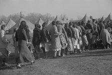 Refugees lined up at meal time in the camp for white flood refugees in Forest City, Arkansas, 1937. Creator: Walker Evans.
