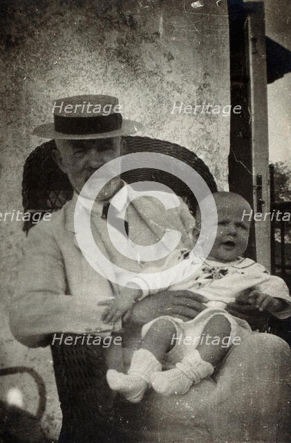 Anton Freiherr von Eiselsberg with a baby. Creator: Unknown.