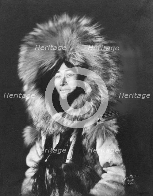 Eskimo woman posing, 1915(?). Creator: Lomen Brothers.