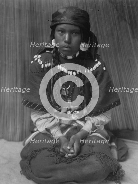 Touch her dress-Kalispel, c1910. Creator: Edward Sheriff Curtis.