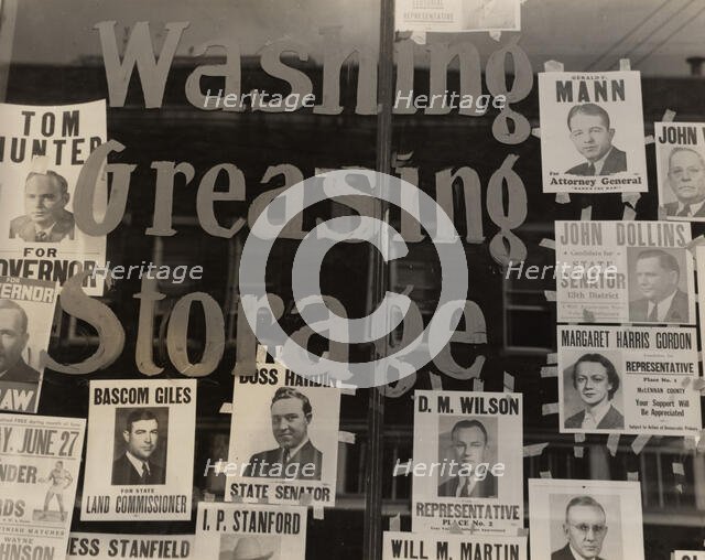 Campaign posters in garage window, just before the primary. Waco, Texas,  1938-06. Creator: Dorothea Lange.