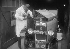 FA Thatcher working on his 1929 Triumph Super Seven. Artist: Bill Brunell.