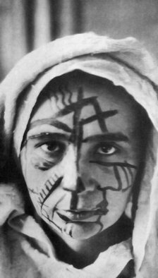 Natalia Goncharova with make-up for the futurist theater, 1913. Creator: Anonymous.