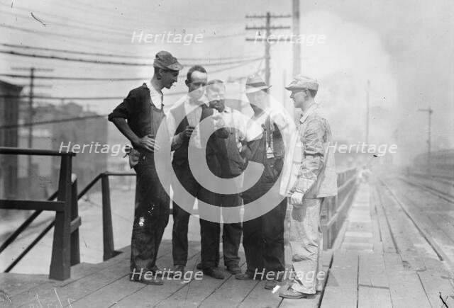 Penn. R.R. [i.e., Railroad] men talk strike, 1910. Creator: Bain News Service.