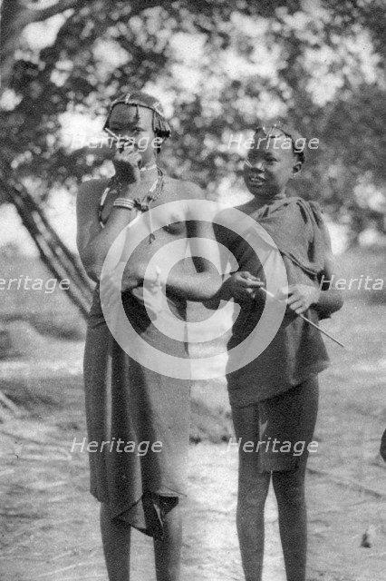 Young girls with sticks in their noses and lips, Terrakekka to Aweil, Sudan, 1925 (1927). Artist: Thomas A Glover