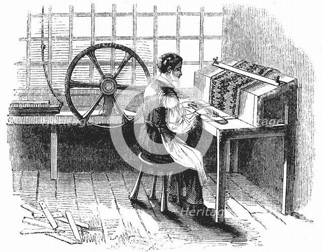 Man operating machine punching cards for Jacquard looms, 1844. Artist: Unknown