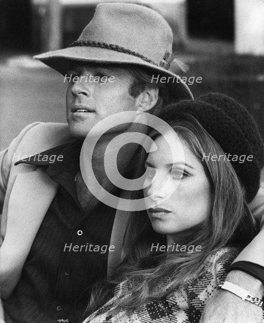 Barbara Streisand (1942-), American singer and actress with Robert Redford (1937-), 1973. Artist: Unknown