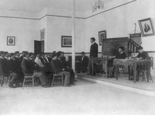Men debating in class, Carlisle Indian School, Carlisle, Pennsylvania, 1901. Creator: Frances Benjamin Johnston.