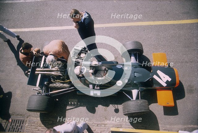 John Surtees in his BRM at the British Grand Prix, Silverstone, Northamptonshire, 1969. Artist: Unknown