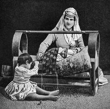 An Armenian mother and her children, 1922.Artist: W Llewellyn Williams