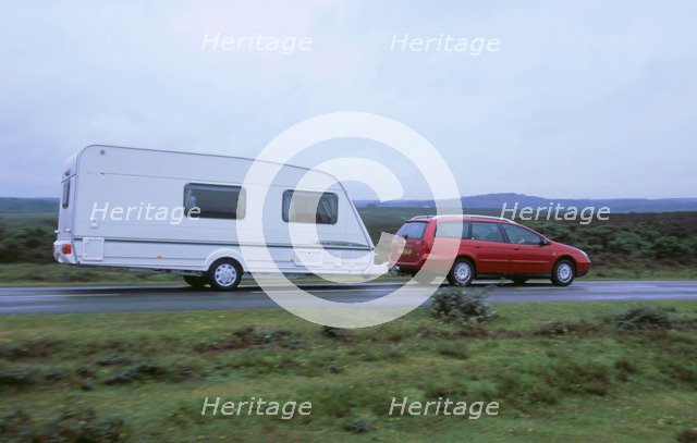 2002 Citroen C5 hdi towing a caravan. Artist: Unknown.