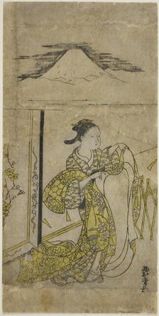 Woman Holding Kimono with Mt. Fuji above, c. 1740s. Creator: Nishimura Shigenaga.