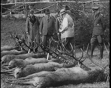 Nazi Officer Hermann Goering in Hunting Dress Showing His Colleagues a Line of Deer He Has..., 1931. Creator: British Pathe Ltd.