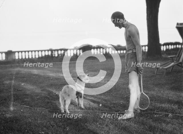 Cosgrave, Mr., with dog, outdoors, not before 1917. Creator: Arnold Genthe.