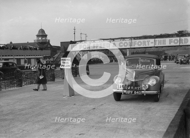 Ford V8 drophead competing in the JCC Rally, Brooklands, Surrey, 1939. Artist: Bill Brunell.