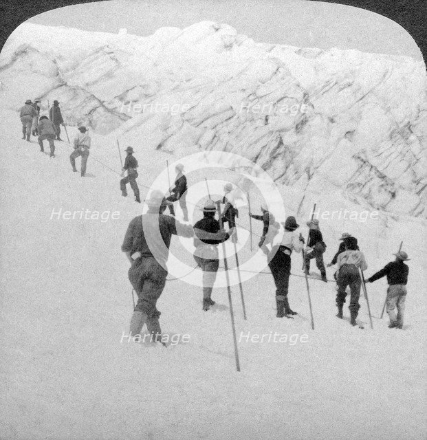 Ascending a steep snowfield, Stevens Glacier, Mount Rainier, Washington, USA.Artist: Underwood & Underwood