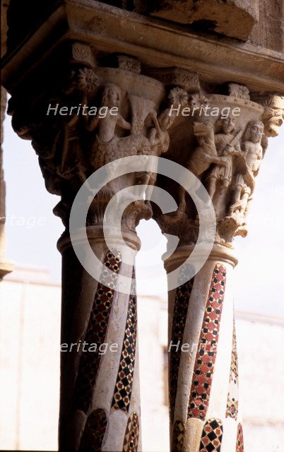 Detail of two capitals with carved figures with allegorical and religious decoration, and columns…