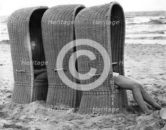 Basket shelters on a beach in Belgium, 1966. 