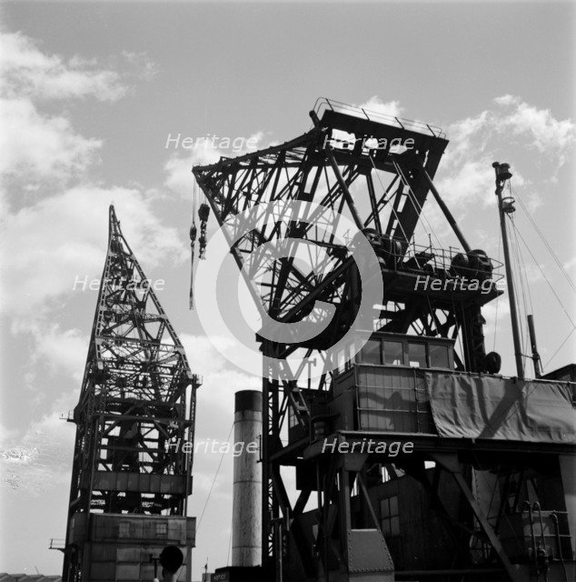 Cranes in London docks, c1945-c1965. Artist: SW Rawlings