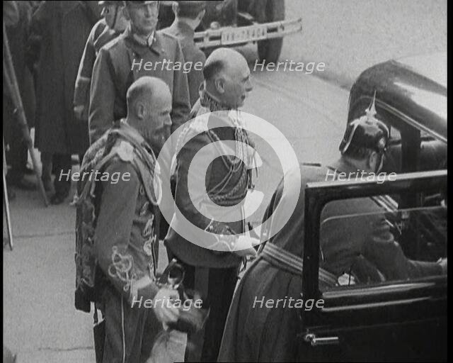 Men Waiting by a Car, 1930s. Creator: British Pathe Ltd.