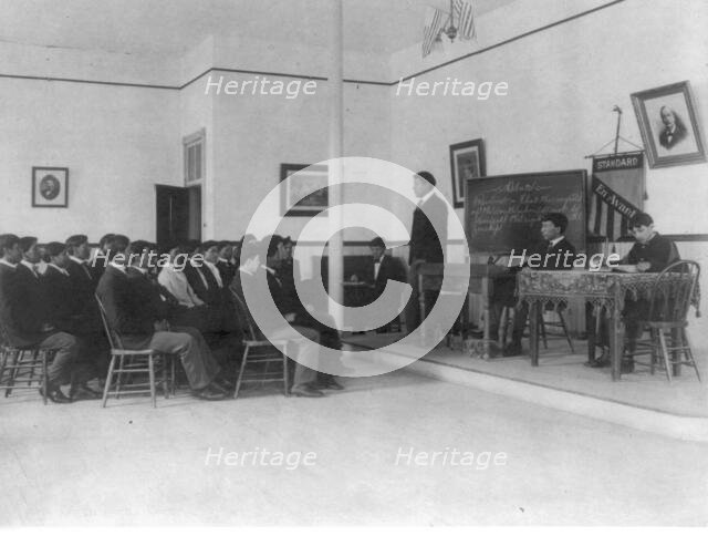 Men debating in class, Carlisle Indian School, Carlisle, Pennsylvania, 1901. Creator: Frances Benjamin Johnston.