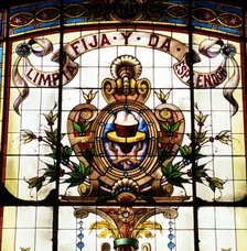 Detail of the badge of the Royal Spanish Language Academy with the motto 'Limpia, fija y da esple…