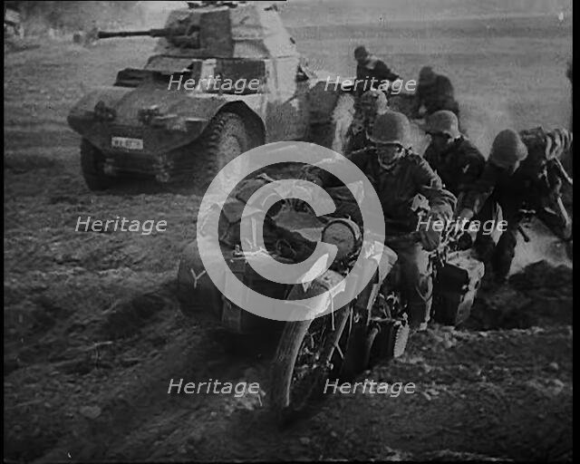 German Soldiers Advancing Through Dusty Fields on Military Vehicles To Cut Off Allied Units..., 1940 Creator: British Pathe Ltd.