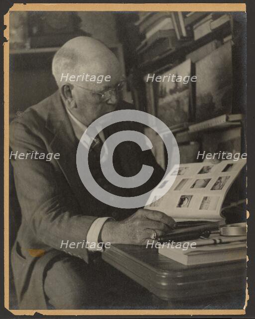 Portrait of a Man Reading Magazine, 1907-1943. Creator: Louis Fleckenstein.