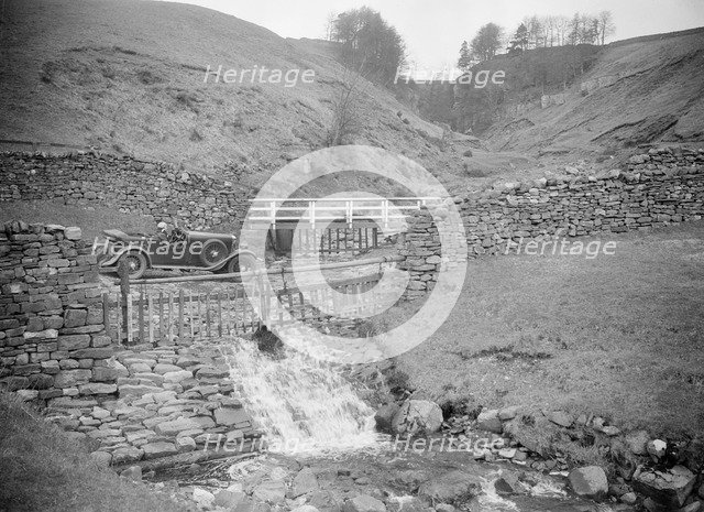 Kitty Brunell road testing a MG 18/80, Tan Hill, Yorkshire, April 1931. Artist: Bill Brunell.