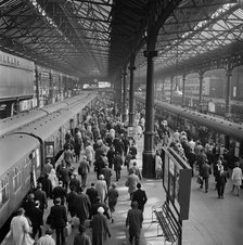 Crowded platforms at Victoria Station, London, 1960-1972. Artist: John Gay