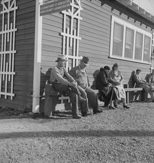 Lineup outside of Farm Security Administration grant office early in the morning, Tulare, CA, 1938. Creator: Dorothea Lange.