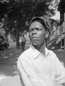 A machine shop worker who lives in the Southwest section, Washington, D.C, 1942. Creator: Gordon Parks.