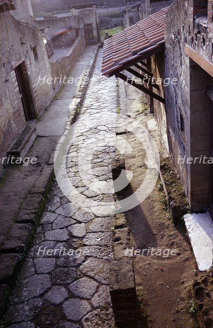 View down Cardo IV (street) from the balcony of the Casa a Graticcio, Herculaneum, Italy. Artist: Unknown